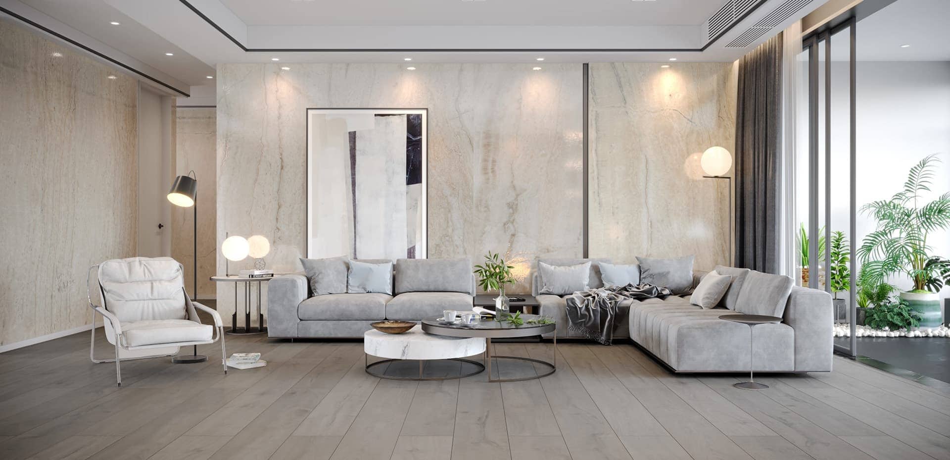 Salon con varios sofas decorado con placas decorativas